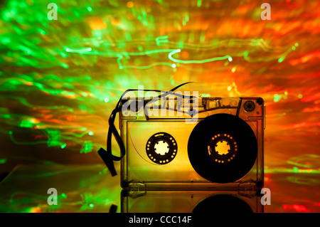 Cassette tape and multicolored yellow green lights on background Stock Photo