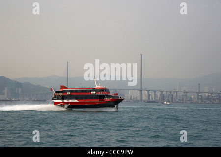 madeira hydrofoil macau ferry crosses belchers bay in victoria harbour in front of the stonecutters bridge hong kong hksar china Stock Photo