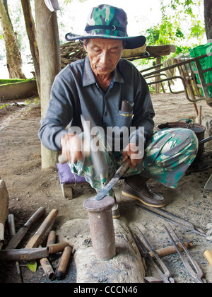 A local blacksmith of Nan is making a knife