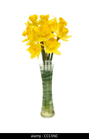 Bunch of daffodils in a green glass vase isolated against white Stock Photo