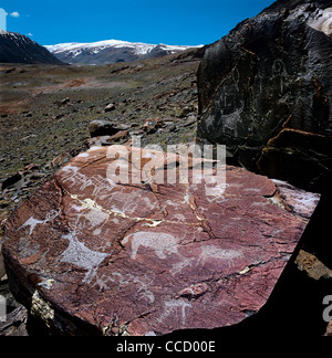 Petroglyphs. Shiveet Khairkhan Mountain nearby. Altai Tavan Bogd National Park. Mongolia Stock Photo