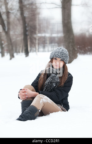 Girl for a walk in the park in the winter