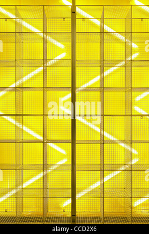 dr marten pop-up store, campaign design, spitalfields, london, uk, 2009. detail shot the wire cage display bold yellow lighting Stock Photo