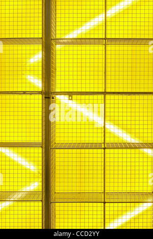 dr marten pop-up store, campaign design, spitalfields, london, uk, 2009. detail shot the wire cage display bold yellow lighting Stock Photo
