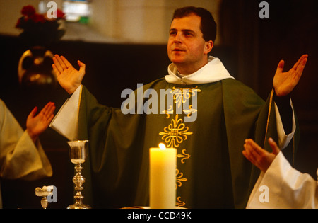 Father Phillipe Dubos, a catholic priest leads Sunday Mass in a local Catholic church in Le Neubourg, Normandy, France. Stock Photo