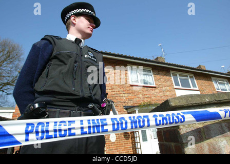 A policeman guards a property. Police Line do not cross tape. Picture by James Boardman