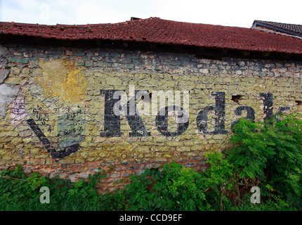 Old Kodak Advertising Mural on Farmhouse Wall in rural France- Close Up Stock Photo