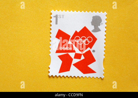 1st class London 2012 Olympics postage stamp on yellow envelope Stock Photo