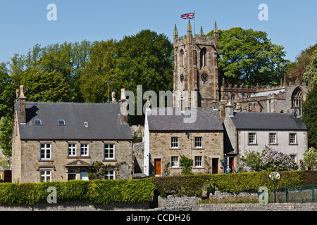 Cottages and St Giles Church in the picturesque Peak District village of Hartington, Derbyshire. Stock Photo