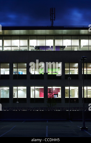 o2 headquarters, tp bennett, bath road, slough, berkshire, uk, 2009. exterior night time view showing the building lit inside Stock Photo