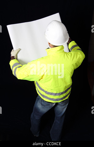 Building worker with plan Stock Photo