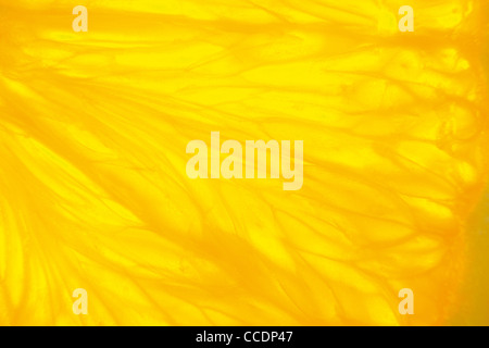 fragment of orange fruit, close-up took with backlight ideal for background Stock Photo