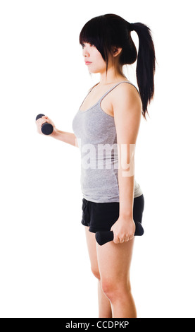 Chinese woman doing bicep curls with small hand weights. Stock Photo