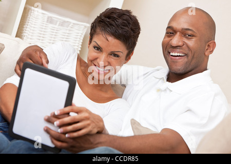 African American Man Woman Couple Using Tablet Computer Stock Photo