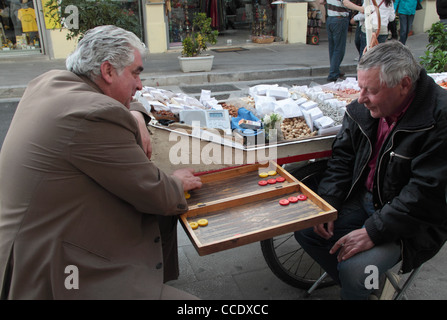 Men playing tavli (backgammon), traditional game in Greece, Monastiraki, Athens, Attica, Greece Stock Photo