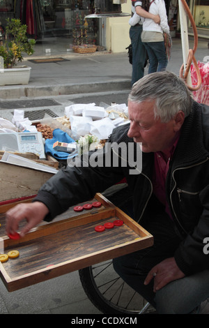 Men playing tavli (backgammon), traditional game in Greece, Monastiraki, Athens, Attica, Greece Stock Photo