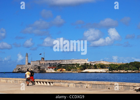 Sea promenade with Morro castle to rear, Havana (Habana), Cuba, Caribbean. Stock Photo