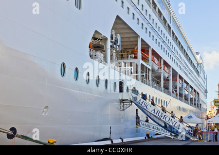 Detail of cruise ship MSC Armonia docked showing mooring lines or hawsers Stock Photo