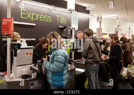 Queue at the express checkout  tills, interior, Marks and Spencer, M&S, Market Square, Cambridge UK Stock Photo
