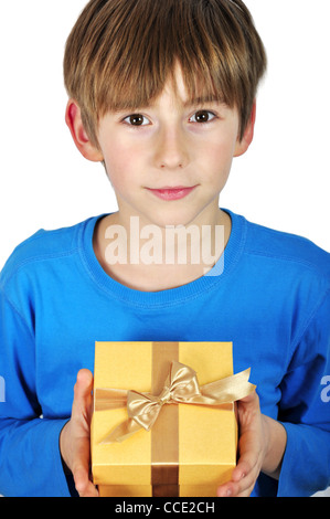 Child holding golden gift box in hand over white Stock Photo