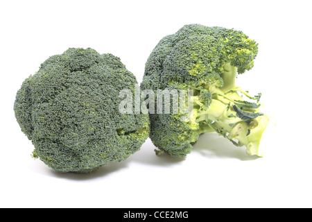 Two healthy broccoli stems on a white surface Stock Photo