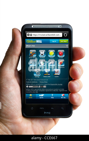 Looking at the William Hill bookmakers website on an HTC smartphone Stock Photo
