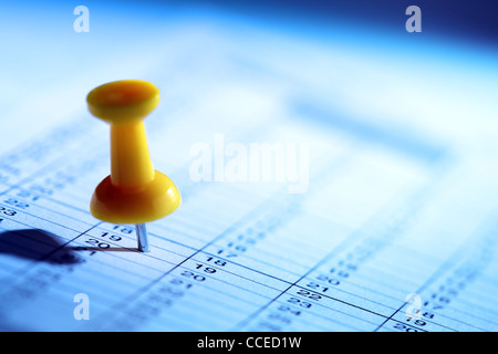 Push pin in calendar Stock Photo
