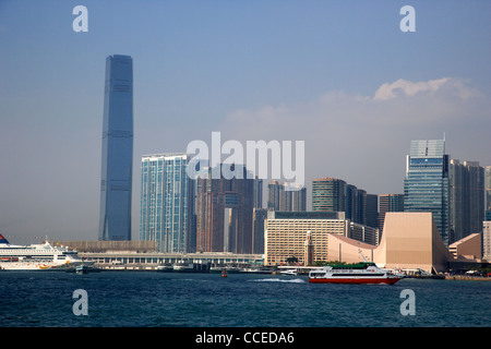 victoria harbour view of kowloon tsim sha tsui skyline including star ferry terminal and international conference centre Stock Photo