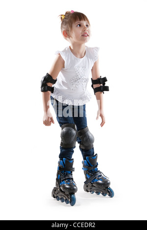 The little girl on roller skates. Isolated white Stock Photo