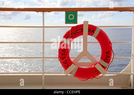 Costa Concordia cruise ship orange lifebuoy safety equipment fixed on open deck. The ship was wrecked due to collision with rock on 13 January 2012 Stock Photo