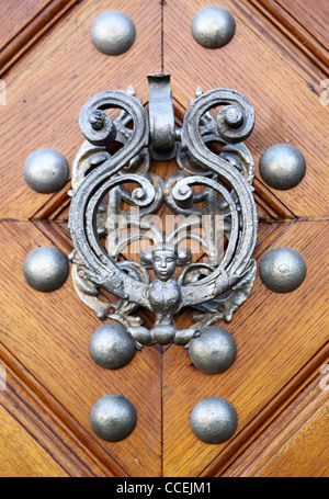 Door knocker in the form of woman with wings Stock Photo