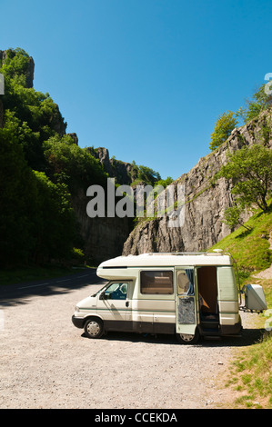 A motorhome parked in the world famous Cheddar Gorge in Somerset on a very sunny summer day. Stock Photo