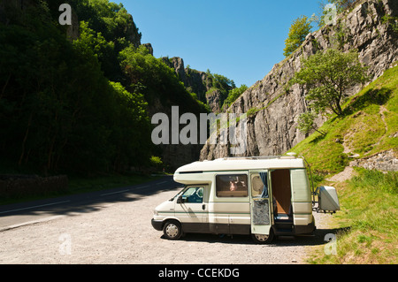 A motorhome parked in the world famous Cheddar Gorge in Somerset on a very sunny summer day. Stock Photo