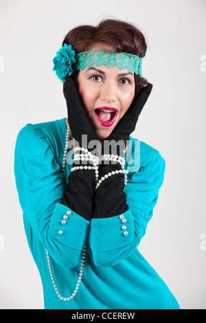 Merry woman in a blue dress and black gloves Stock Photo