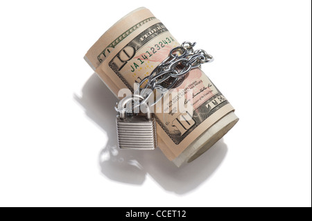 A roll of 10 dollar notes with a padlock and chain around it Stock Photo