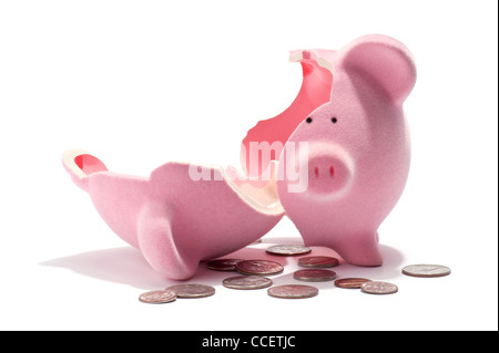 A broken piggy bank and American coins Stock Photo