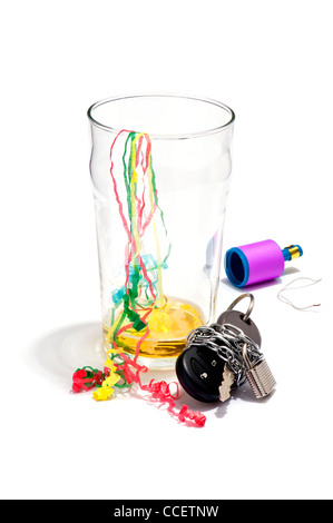 An empty pint of beer, streamers and a car key chained and padlocked