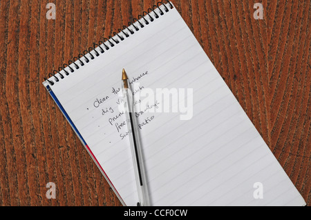 Agony list. List of jobs made on notepad. Ball point pen. Stock Photo