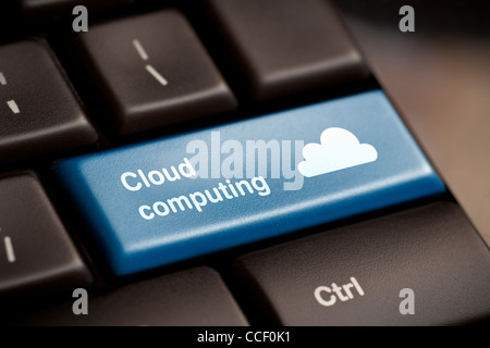 Cloud computing concept showing cloud icon on computer key. Stock Photo