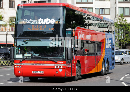 Bus driver working on a 'Oxford Tube' double decker coach service between London and Oxford operated by Stagecoach driving along Park Lane Mayfair UK Stock Photo