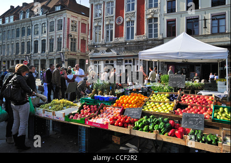 Customers buying fruit and vegetables at market stall, Lille, France Stock Photo