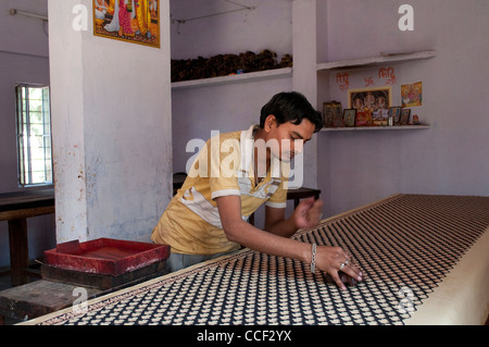 Man printing at Fabric block printing workshop, Bagru village, Jaipur, Rajasthan, India Stock Photo