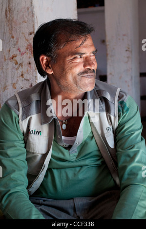 Middle-aged Rajasthani man smiling, Fabric block printing workshop, Bagru village, Jaipur, Rajasthan, India Stock Photo