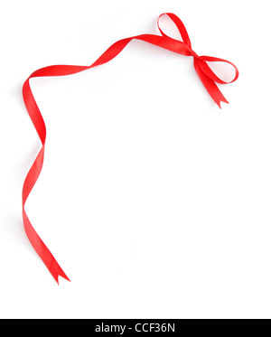A thin curly red ribbon for Christmas and birthday present banner isolated  against a white background Stock Photo - Alamy