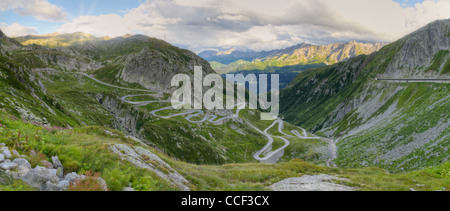 road with tight serpentines on the southern side of the St. Gotthard pass bridging swiss alps at sunset in Switzerland, europe Stock Photo