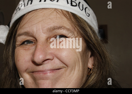 middle-aged woman wearing bah humbug hat