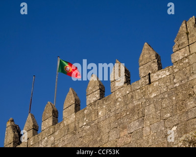Portuguese flag on top of the Sao Miguel castle in Guimaraes, Portugal Stock Photo
