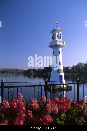 Captain Scott Memorial Lighthouse with flowers in foreground Roath Park Lake Cardiff South Wales UK Stock Photo