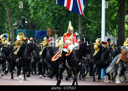 Household Cavalry Life Guard officer and band passing along Pall Mall during Trooping the Colour, London , England 2011 Stock Photo