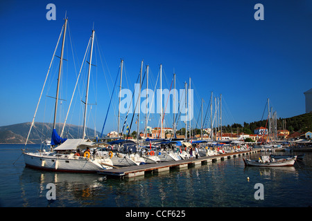 Yachts in the small marina of Fiskardo village, one of the most beautiful of Kefalonia island, favorite of the skippers. Greece. Stock Photo